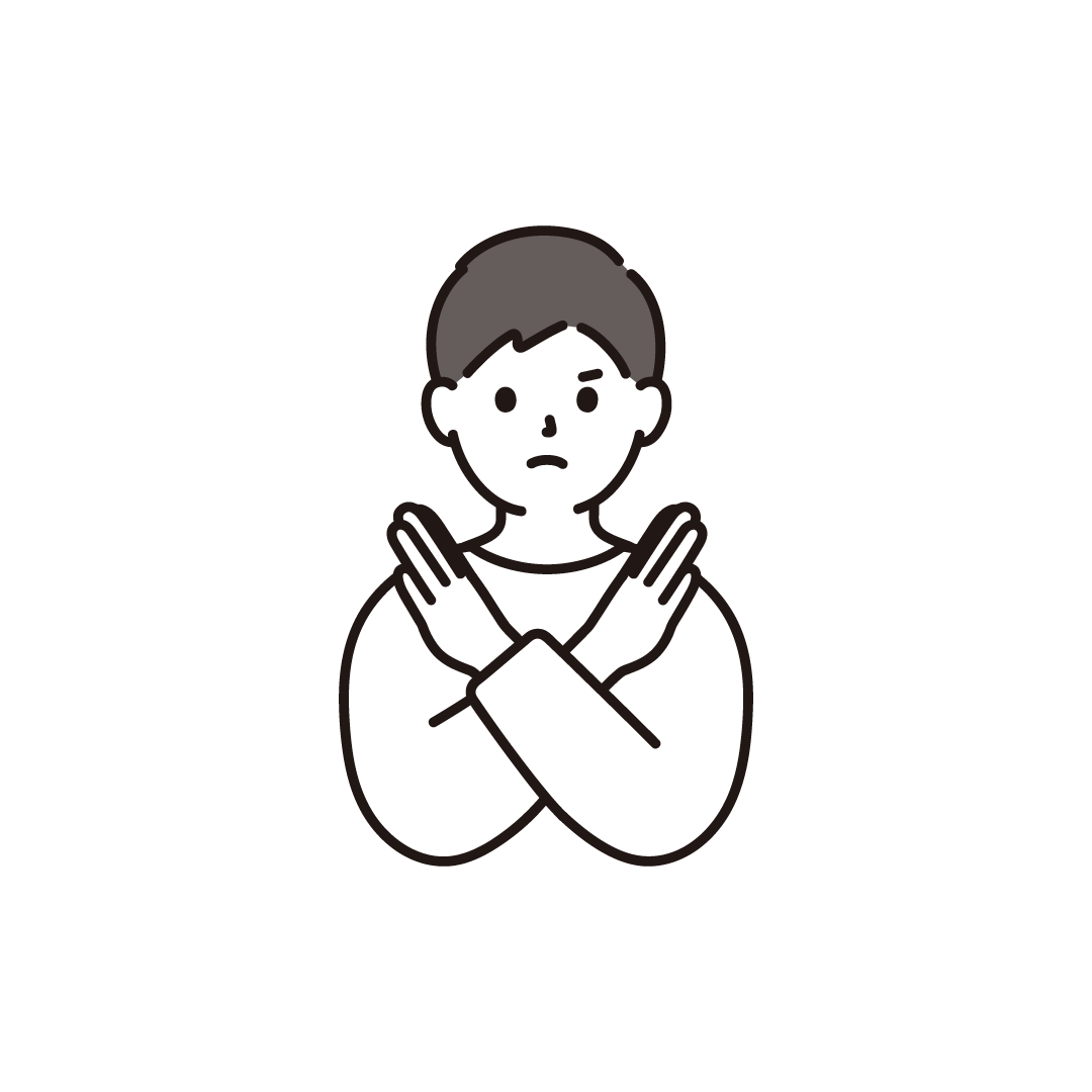 バツポーズをする男性