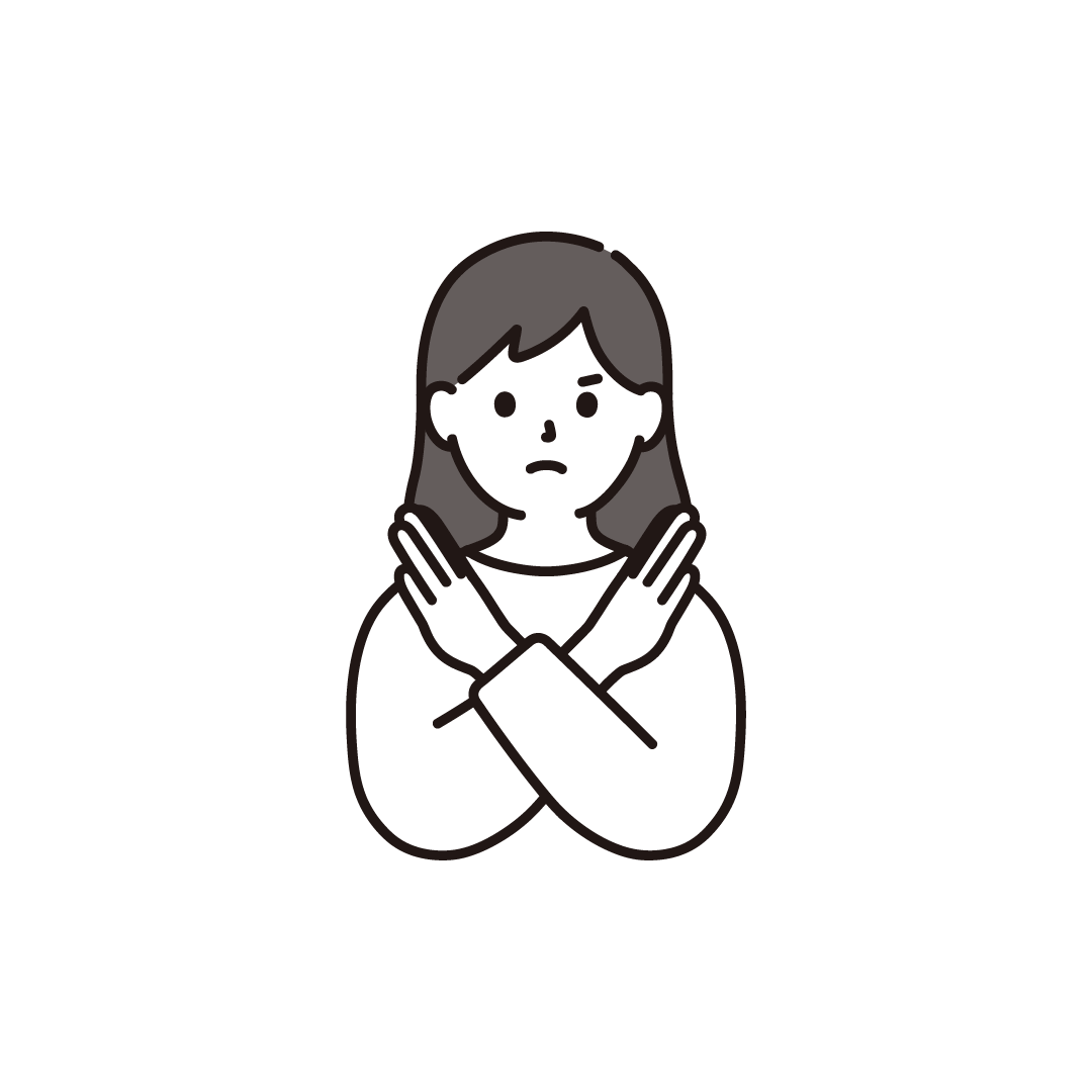 バツポーズをする女性