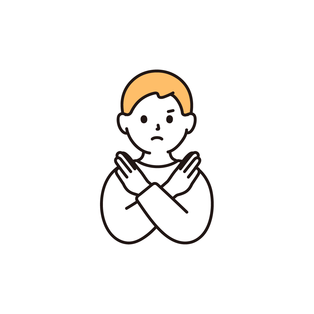 バツポーズをする男の子