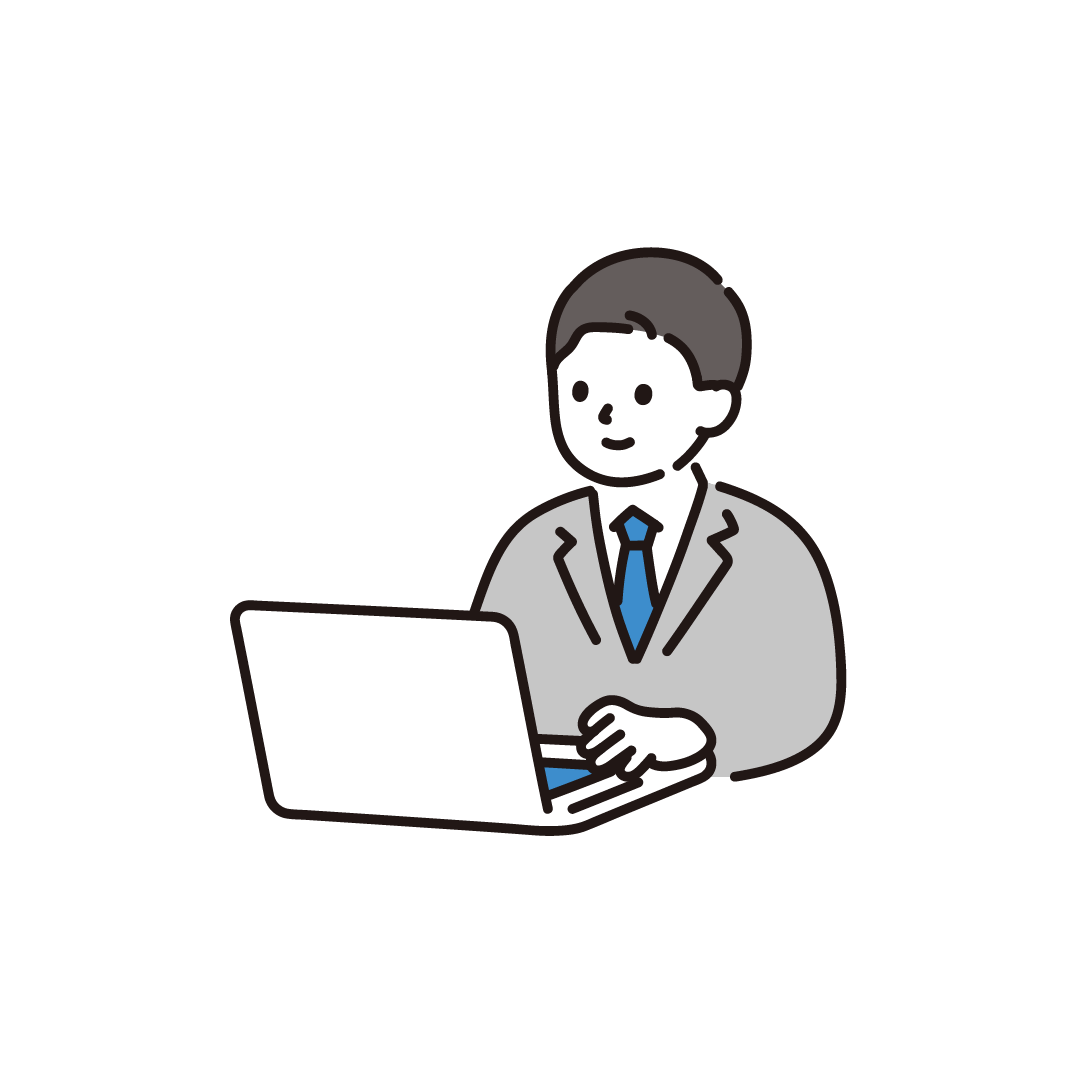 パソコンを使うビジネス男性（斜め）