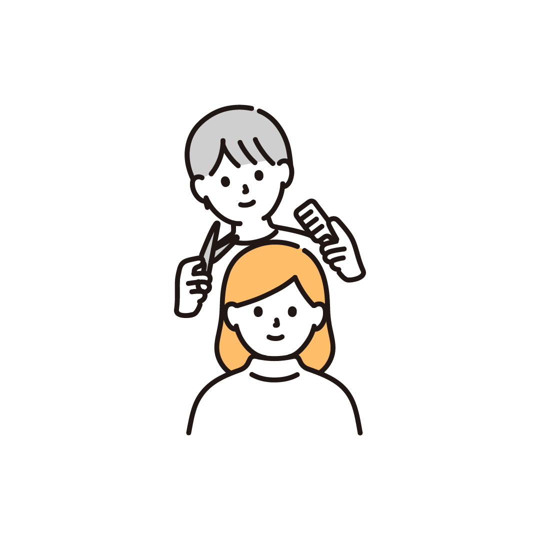 髪を切る美容師（女性）