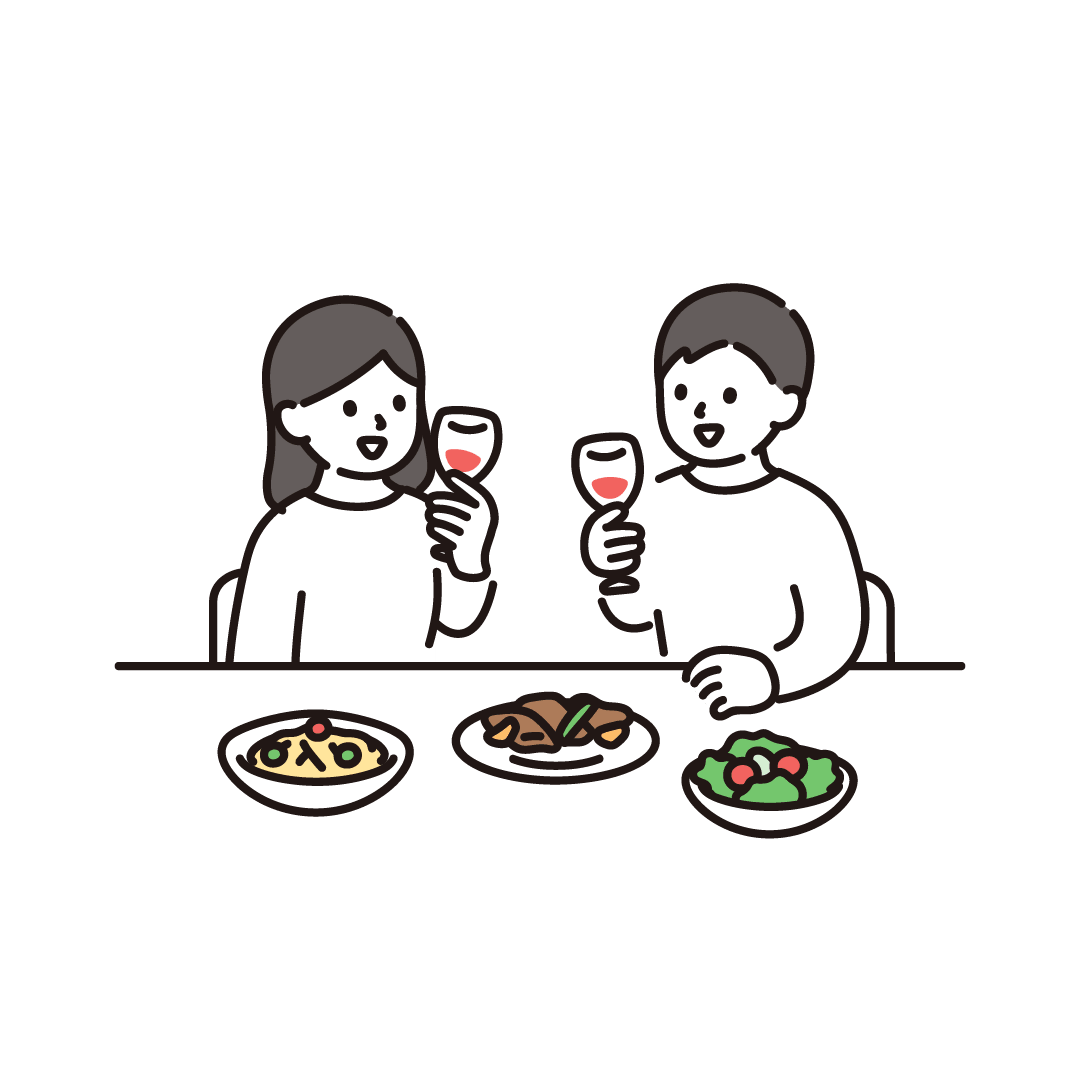 お祝いの食事をする男女