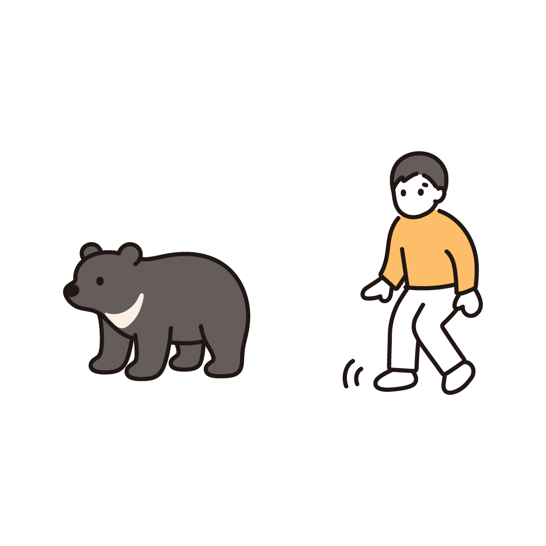 熊を見つけて後ずさりする人