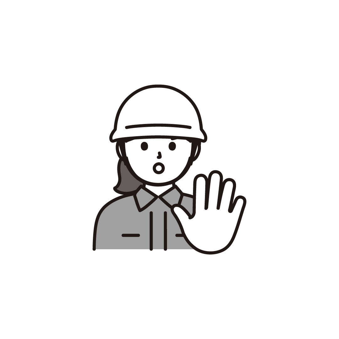 ストップポーズをする作業着女性