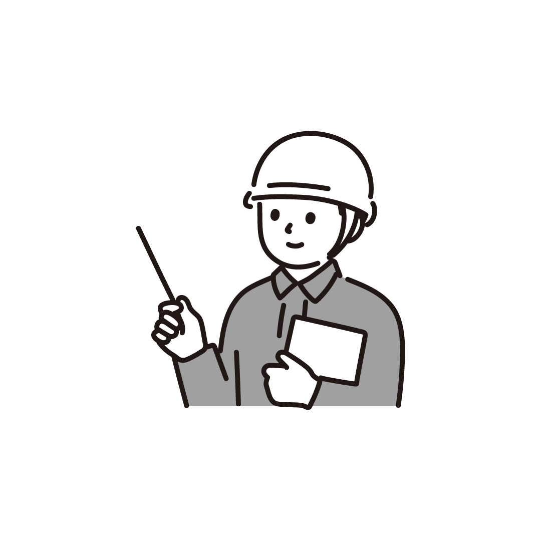説明する作業着の男性